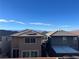 Backyard view showing neighboring houses with patio covers under a clear blue sky at 365 Andy Wheeler Dr, Henderson, NV 89011