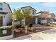 Two-story home with a two-car garage and well maintained landscaping and bushes at 365 Andy Wheeler Dr, Henderson, NV 89011