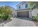 Beautiful home with a two-car garage, appealing architecture, and low-maintenance landscape at 365 Andy Wheeler Dr, Henderson, NV 89011
