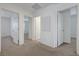 Upstairs hallway with neutral carpet, white walls, and access to multiple rooms at 365 Andy Wheeler Dr, Henderson, NV 89011