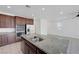 Kitchen with large island, double sink, stainless steel appliances, and granite countertops at 365 Andy Wheeler Dr, Henderson, NV 89011