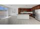 Bright kitchen with stainless appliances, granite countertops, and access to the backyard at 365 Andy Wheeler Dr, Henderson, NV 89011
