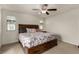 Main bedroom features a wood accent wall, carpeted floors, and a ceiling fan at 365 Andy Wheeler Dr, Henderson, NV 89011