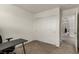 Office space with sliding closet doors and access to the hallway at 365 Andy Wheeler Dr, Henderson, NV 89011
