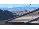 View of neighboring rooftops, with the city skyline and mountain range in the distance at 365 Andy Wheeler Dr, Henderson, NV 89011