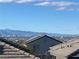 Scenic rooftop view with blue skies, rolling mountains, and a sprawling cityscape at 365 Andy Wheeler Dr, Henderson, NV 89011