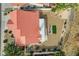 Aerial view of the home showcasing the backyard with desert landscaping, patio, and red tile roof at 412 Lost Trail Dr, Henderson, NV 89014