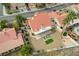 Aerial view of the home highlighting the backyard with desert landscaping and covered patio at 412 Lost Trail Dr, Henderson, NV 89014