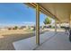 Spacious backyard features a covered patio and desert landscaping with views at 412 Lost Trail Dr, Henderson, NV 89014