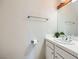 Neutral bathroom featuring a large mirror, tile countertop, and chrome fixtures at 412 Lost Trail Dr, Henderson, NV 89014