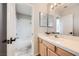 Full bathroom with a shower-tub combo and a tile countertop with a large mirror at 412 Lost Trail Dr, Henderson, NV 89014
