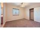 Cozy bedroom with carpet, window with blinds, and closet at 412 Lost Trail Dr, Henderson, NV 89014