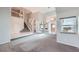 Open-concept living room featuring a high ceiling, staircase, and lots of natural light at 412 Lost Trail Dr, Henderson, NV 89014
