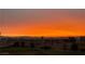 Stunning sunset view overlooking the city from this home's outdoor space and fenced backyard at 412 Lost Trail Dr, Henderson, NV 89014