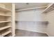 Large walk-in closet with built-in shelving, carpet, and ample storage space at 412 Lost Trail Dr, Henderson, NV 89014