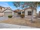 Charming single-story home featuring a two-car garage and low maintenance desert landscaping at 4546 Cliff Breeze Dr, North Las Vegas, NV 89081