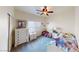 Bedroom featuring a ceiling fan, carpeted floors, and natural light at 4780 Lorenzo Way, Pahrump, NV 89061