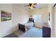 Bedroom featuring a ceiling fan, carpeted floors, and natural light at 4780 Lorenzo Way, Pahrump, NV 89061