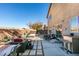 Spacious backyard with patio seating, hot tub, and built-in bar at 5859 Noble Stand St, Las Vegas, NV 89148
