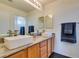 Elegant bathroom with dual vanities, granite countertops, and a large mirror at 5859 Noble Stand St, Las Vegas, NV 89148