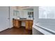 Modern bathroom with dual vanities, granite countertops, and a soaking tub at 5859 Noble Stand St, Las Vegas, NV 89148