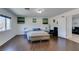 Bright bedroom with hardwood floors, plush bed, and modern furnishings at 5859 Noble Stand St, Las Vegas, NV 89148