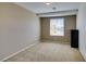 Simple bedroom with carpeted floors and a window with blinds at 5859 Noble Stand St, Las Vegas, NV 89148