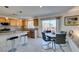 Kitchen with island, stainless steel appliances, and eat-in area at 5859 Noble Stand St, Las Vegas, NV 89148