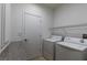 Bright laundry room with washer, dryer, and countertop space at 5859 Noble Stand St, Las Vegas, NV 89148