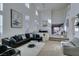 Spacious living room with high ceilings and L-shaped sectional sofa at 5859 Noble Stand St, Las Vegas, NV 89148