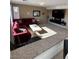 Inviting living room featuring a comfortable sectional sofa and a modern entertainment center at 5859 Noble Stand St, Las Vegas, NV 89148