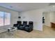 Relaxing media room featuring three leather recliners and a glass-top coffee table at 5859 Noble Stand St, Las Vegas, NV 89148