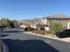 Picturesque street view showcasing well-maintained homes and landscaping in a peaceful neighborhood at 5859 Noble Stand St, Las Vegas, NV 89148