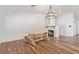 Farmhouse-style dining room with a large wooden table and chandelier at 6168 Isthmus Cir, Las Vegas, NV 89110