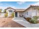 Single story home with front porch and neatly landscaped yard at 6168 Isthmus Cir, Las Vegas, NV 89110