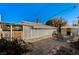 Private backyard with mature landscaping and a paved patio perfect for outdoor seating and relaxation at 632 Avenue D, Boulder City, NV 89005