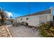 Paver patio with outdoor seating and vibrant garden beds offer a relaxing backyard space at 632 Avenue D, Boulder City, NV 89005