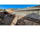 This backyard patio includes brick flooring and a lattice privacy fence at 632 Avenue D, Boulder City, NV 89005