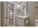 Bathroom featuring a gray vanity, sleek fixtures, and neutral wall color at 632 Avenue D, Boulder City, NV 89005