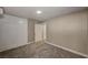 Spacious carpeted bedroom with a built-in wardrobe/cabinet and a neutral color scheme at 632 Avenue D, Boulder City, NV 89005