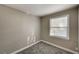 Small, cozy carpeted bedroom with neutral paint and a window at 632 Avenue D, Boulder City, NV 89005