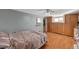 Spacious bedroom features wood-look flooring, and ample built in storage, and a ceiling fan at 632 Avenue D, Boulder City, NV 89005