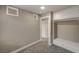Bedroom featuring neutral colors, carpet, bright lighting, closet, and a large window at 632 Avenue D, Boulder City, NV 89005