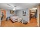 Comfortable bedroom featuring wood laminate flooring, a ceiling fan, and an open closet area at 632 Avenue D, Boulder City, NV 89005