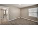 Cozy bedroom with plush carpet and natural light; adjoining rooms at 632 Avenue D, Boulder City, NV 89005