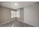 This cozy bedroom boasts soft gray walls, carpet, natural light and built-in storage at 632 Avenue D, Boulder City, NV 89005