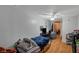 Functional bedroom featuring wood-look flooring, a ceiling fan, and access to an additional storage or closet space at 632 Avenue D, Boulder City, NV 89005