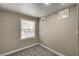 Small, cozy carpeted bedroom with neutral paint, a window, and bright lighting at 632 Avenue D, Boulder City, NV 89005
