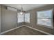 Bright dining space with wood-look floors, AC unit, and abundant natural light at 632 Avenue D, Boulder City, NV 89005