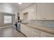Bright kitchen features stainless steel appliances, tile counters and backsplash, and ample cabinet space at 632 Avenue D, Boulder City, NV 89005
